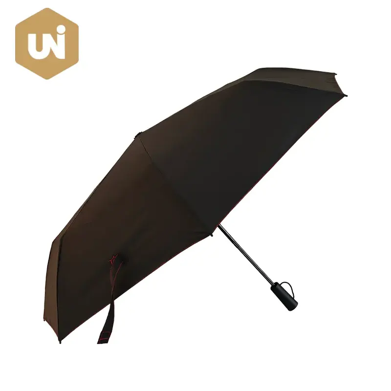 Parapluie ouvert manuel de couleur contrastée noir et rouge